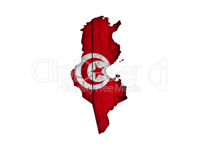 Karte und Fahne von Tunesien auf verwittertem Holz