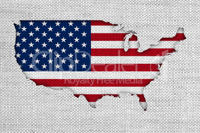 Karte und Fahne der USA auf altem Leinen
