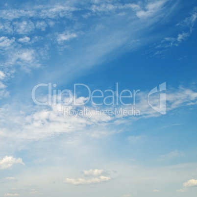 light cumulus clouds in the blue sky