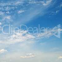 light cumulus clouds in the blue sky