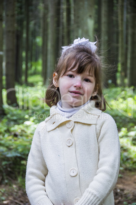 little girl in forest