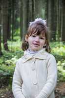 little girl in forest