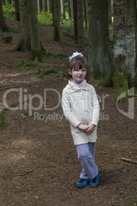 little girl in forest
