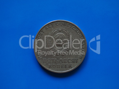 Vintage Russian ruble coin over blue