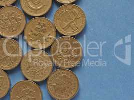 Pound coins, United Kingdom over blue with copy space
