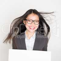 Businesswoman with white blank paper card