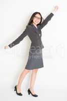 Asian businesswoman arm grabbing something