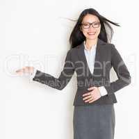 Businesswoman hand showing something