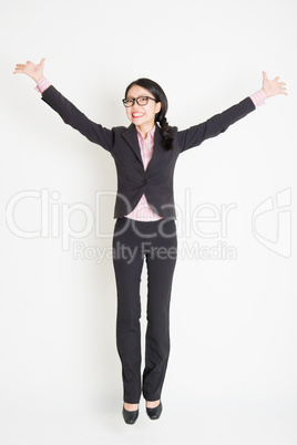 Asian businesswoman jumping