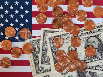 Dollar notes and coins and flag of the United States