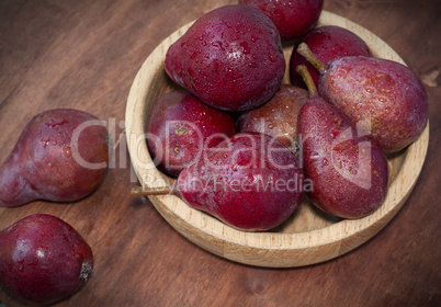 Sweet red pears on the wooden table