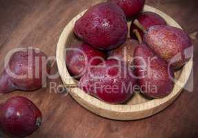 Sweet red pears on the wooden table