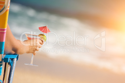Woman on Beach with Tropical Drink