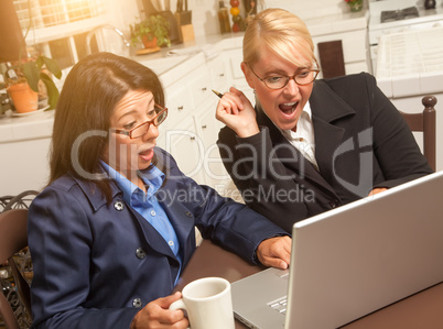 Businesswomen Celebrate Success on the Laptop