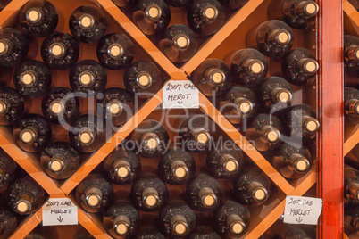 Several Varietal Wine Bottles Age Inside Cellar