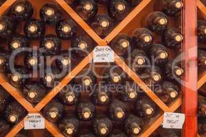 Several Varietal Wine Bottles Age Inside Cellar