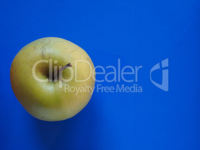 green apple fruit food over blue with copy space