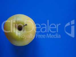 green apple fruit food over blue with copy space