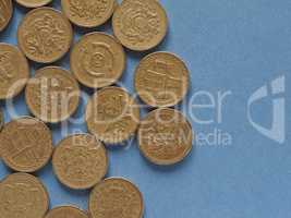 Pound coins, United Kingdom over blue with copy space