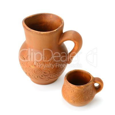 clay jug and a mug isolated on white background