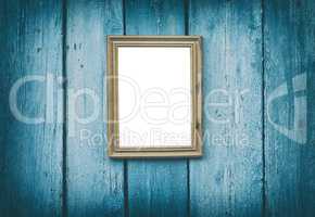 empty wooden frame hanging on blue cracked wooden wall