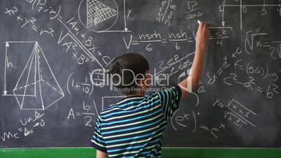 Confident Latino Boy Smiling At Camera During Math Lesson