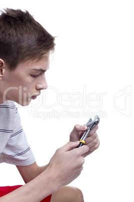 Young man holding metal wrench