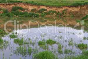 sand pit filled with water summer landscape