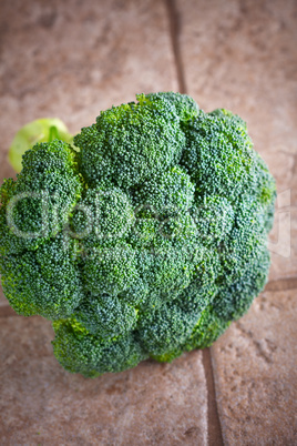 Green fresh head of Broccoli on a stone surface
