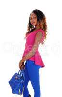 Beautiful tall woman with blue purse.