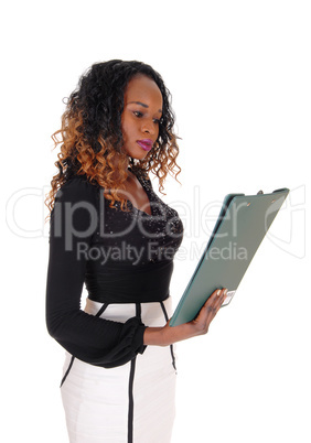 Serious woman reading her paper.