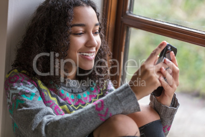 Mixed Race African American Girl Teenager on Cell Phone