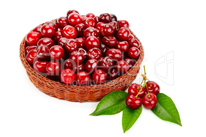 Ripe cherries in the basket isolated on white background