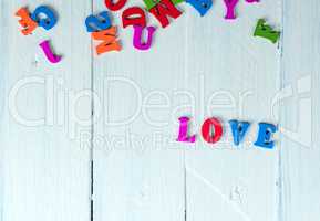 white wooden background with the word love