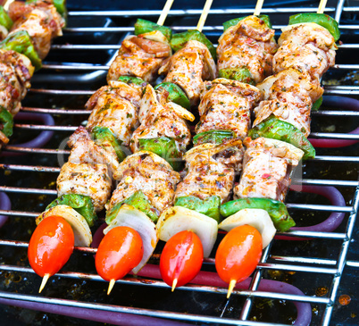 Sizzling barbecue sticks with meat and vegetables