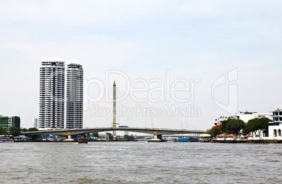 Riverside view. Bridge over Chao Phraya River, Bangkok, Thailand
