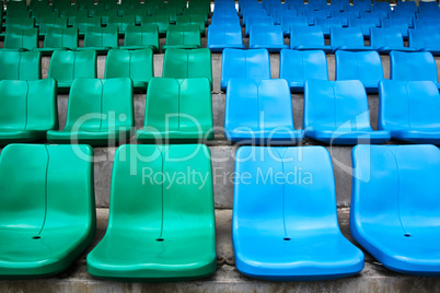 Green and blue stadium seats.