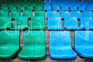 Green and blue stadium seats.