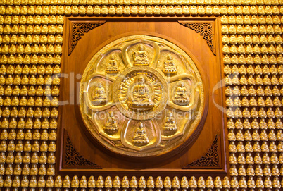Buddha on the wall at Chinese temple in Thailand