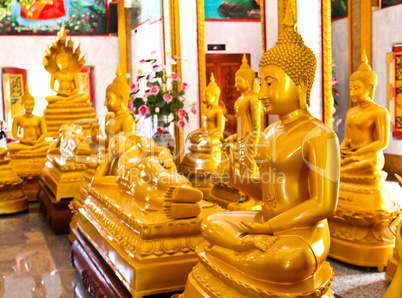 Buddhas inside the Wat Chalong temple, Phuket, Thailand.