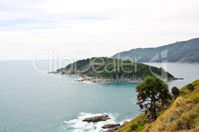 A small island lies off the coast of Phuket, Thailand.