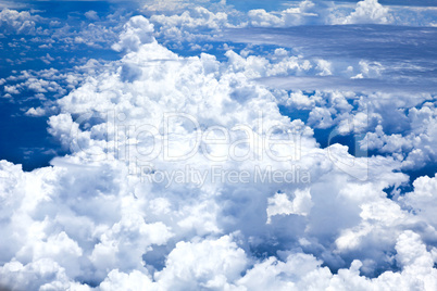 Blue sky and Clouds looking from the Airplane