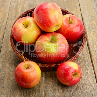 red apples on a wooden surface