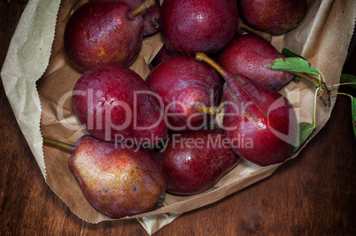 Red ripe pears in a paper bag