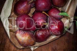 Red ripe pears in a paper bag