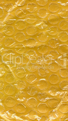 Yellow bubble wrap texture background - vertical