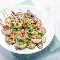 Salad with Fried zucchini on a white background.