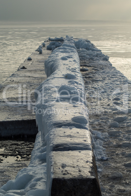 Ice-covered Pier Early in a Morning