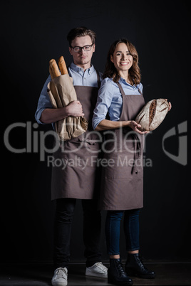 Bakers holding bread