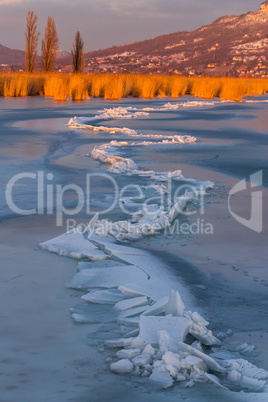 A lot of iceblocks on each other in Lake Balaton on the sunset l